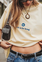 LIFE IS FOR LIVING T-SHIRT IN BUTTERCREAM